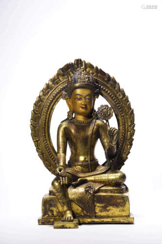 A Gilt Bronze Statue Of Medicine Buddha