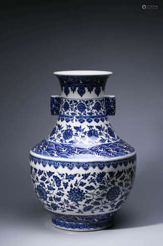 A Blue And White Interlocking Lotus And Wave Zun Vase