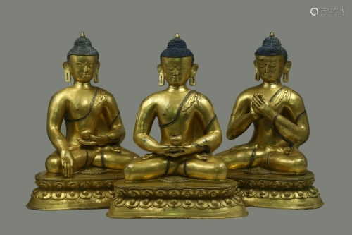 A Group of Three Gilt Bronze Buddha Statues