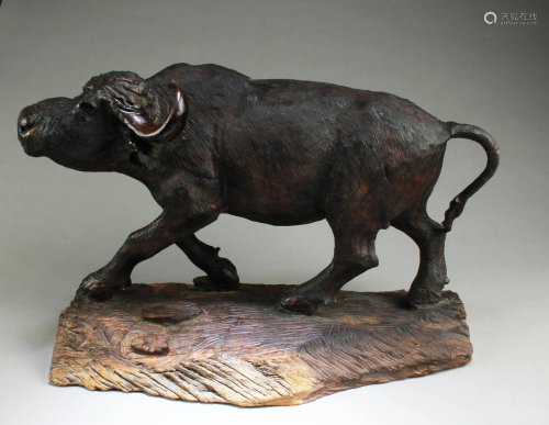 A Carved Wooden Water Buffalo Figurine