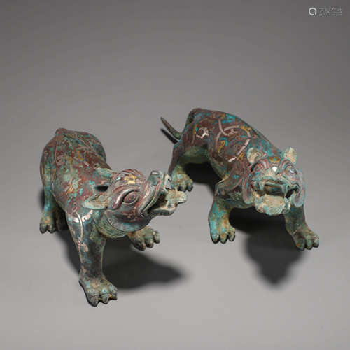 A Pair of Chinese Gold and Silver Inlaid Bronze Beasts