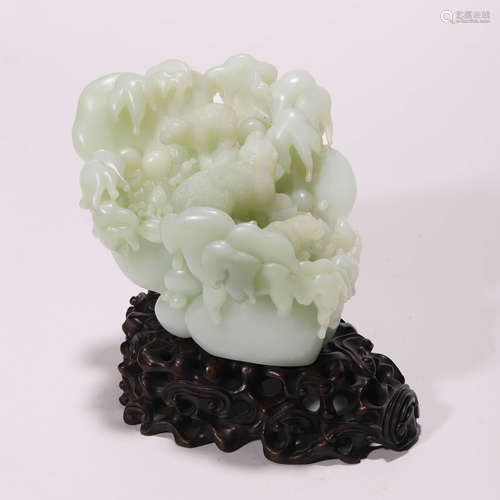 A Chinese White Jade Carving and Stand