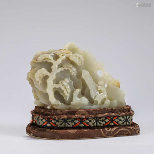 A Chinese White Jade Carving and Stand