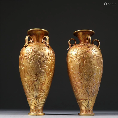 Old stock, a pair of copper gilt ornaments.