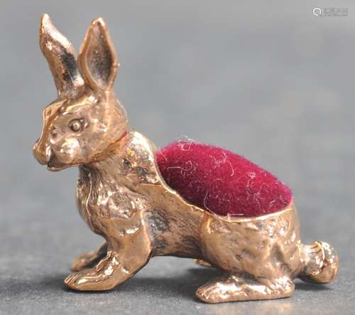 20TH CENTURY BRASS PIN CUSHION IN THE FORM OF A HARE.