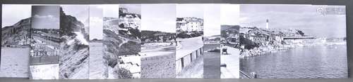 TWELVE BLACK AND WHITE PRINTEDPOSTCARD PHOTOGRAPHS OF SEASID...