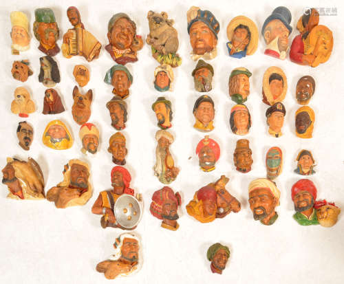 LARGE COLLECTION OF PLASTER BOSSONS HEADS MASKS