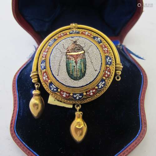 A 19th century micromosaic and gold brooch, the domed plaque...