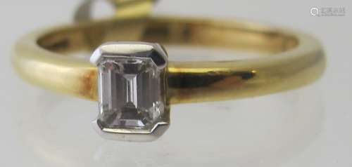 An 18ct yellow gold baguette cut diamond single stone ring, ...