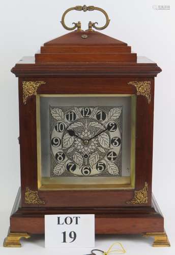 A turn of the century mahogany cased double fusee bracket cl...