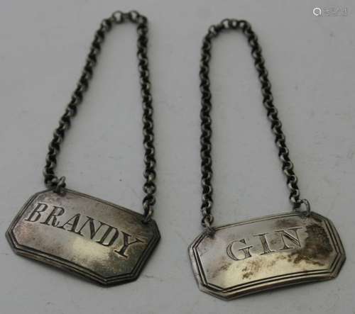 A pair of silver decanter labels 'Brandy' and 'Gin', approx ...