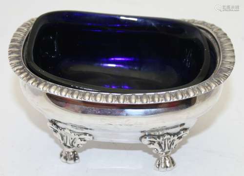 A Georgian silver rectangular salt with lion paw feet, blue ...