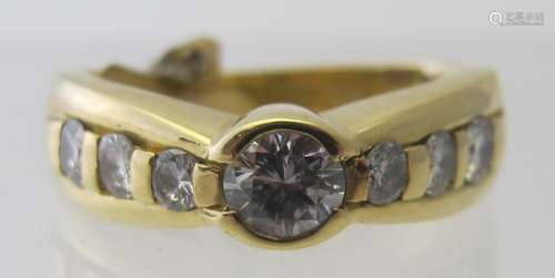 An 18ct yellow gold diamond ring set with centre diamond and...