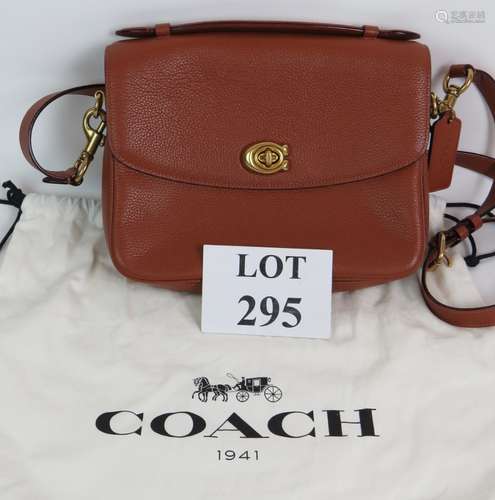 A Coach Cassie tan grained leather satchel handbag with brus...