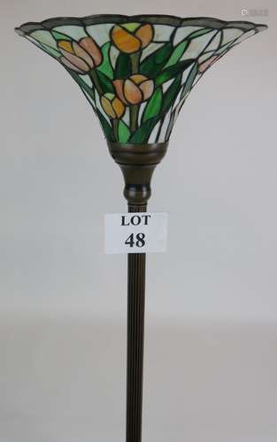 A Tiffany style up-lighter floor lamp with tulip decorated s...