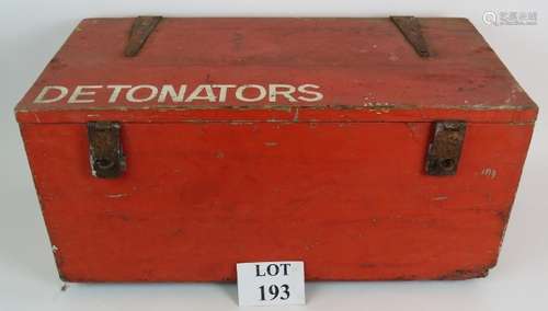 A vintage wooden detonator explosives storage painted red an...