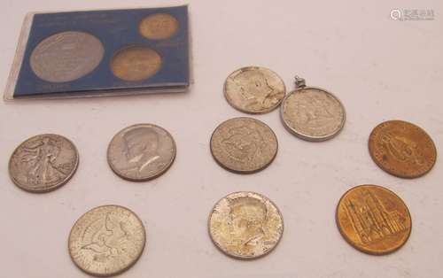 A collection of twelve coins/medallions, mainly half dollar ...