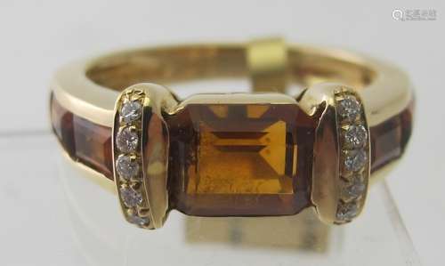 An 18ct yellow gold ring set with five step cut citrines.