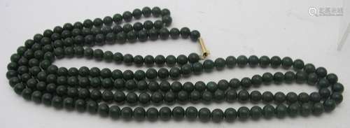 A long jade necklace approx 56