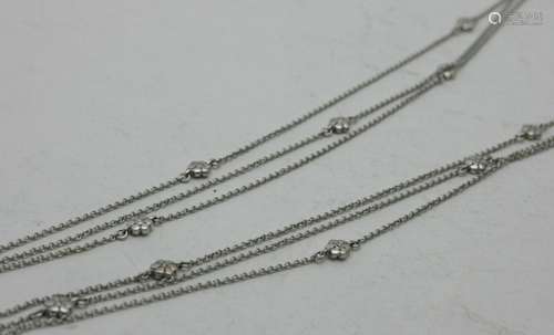 A fine 18ct white gold three strand fine link necklace, inte...