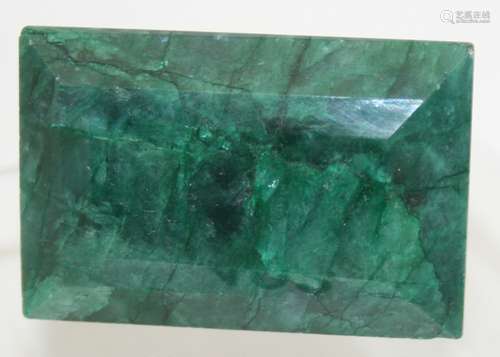 A large green natural emerald (Beryl) of rectangular step, a...