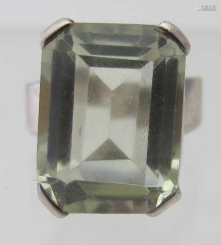 A silver ring set with an emerald cut citrine, approx 20mm x...