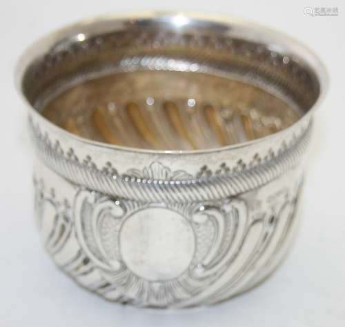 A Victorian silver porringer with hand chased half swirl flu...