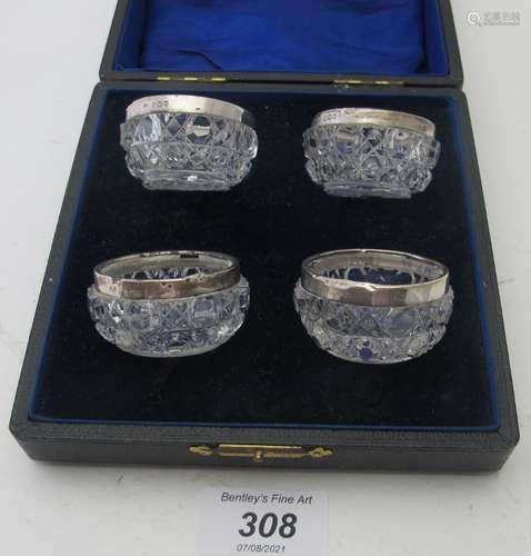 A set of four hobnail cut silver rimmed salts, London 1909, ...