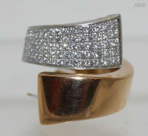 A heavy 18ct yellow gold and platinum wrap over ring,