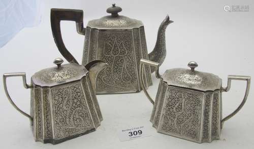 An Eastern white metal finely engrave teapot, cream jug & su...