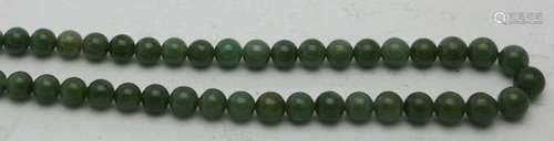 A jade bead necklace with silver clasp, approx 28