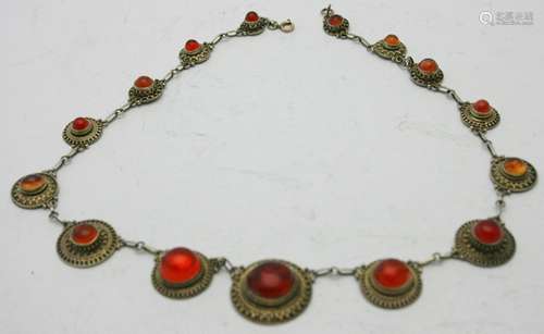 A fine amber mounted white metal necklace consisting of fift...