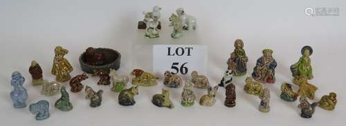 A collection of Wade pottery Whimsies and figures, some earl...