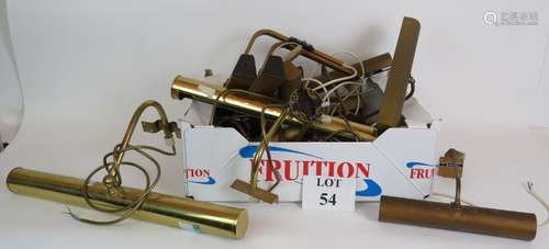 A quantity of brass over picture wall lights of varying size...