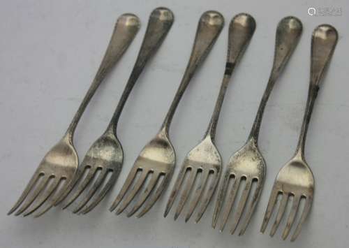 A set of six Georgian silver feather edge dinner forks, Lond...