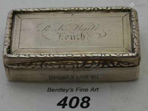 A Georgian silver rectangular snuff box with gilded interior...