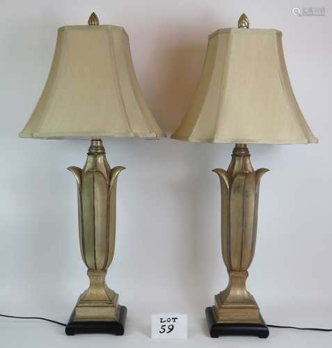 An elegant pair of contemporary gilt lotus leaf shaped lamps...