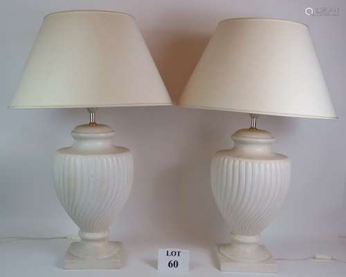 A pair of contemporary classical urn shaped ceramic lamps wi...