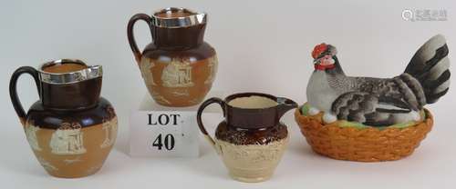 Two Royal Doulton Stoneware harvest jugs both with silver mo...