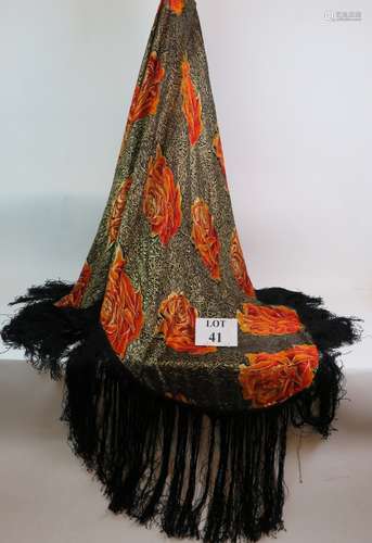 A vintage stylish black silk shawl with orange and gold flow...