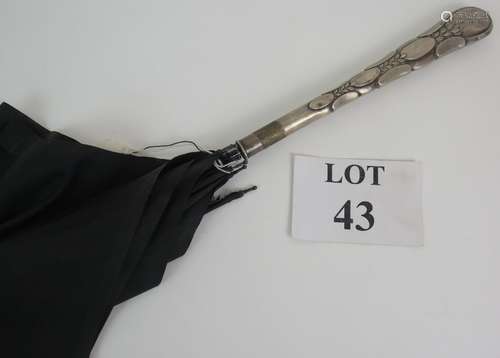 An Art Nouveau continental silver handled umbrella/parasol c...