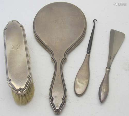 A silver hand mirror and matching clothes brush, Mappin & We...