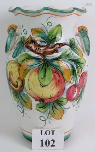 A large glazed Italian terracotta vase with hand painted fru...