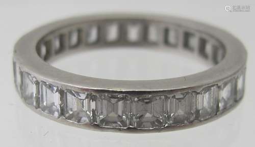 A hand made platinum & diamond eternity ring. The 25 emerald...