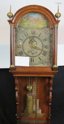 An antique oak cased continental wall clock.