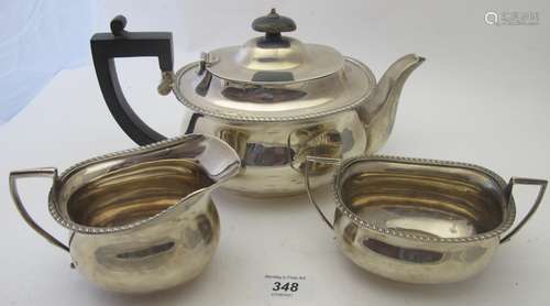 A three piece silver tea service comprising of teapot,