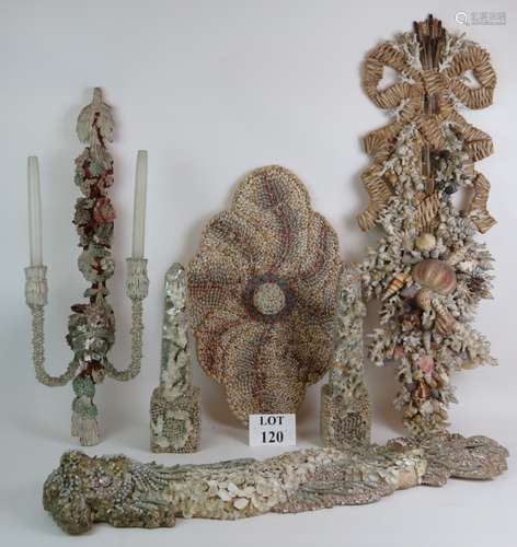 Two ornate decorative shell and coral wall hangings, a simil...