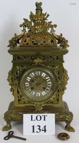 An ornate French brass mantle clock by J Marti & Co (c1880),