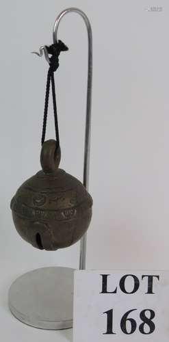 A Thai bronze cowbell on contemporary stand, height 29cm. Co...