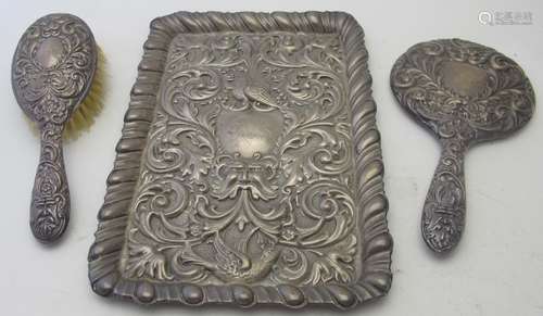 A heavily embossed monogrammed silver dressing table tray de...